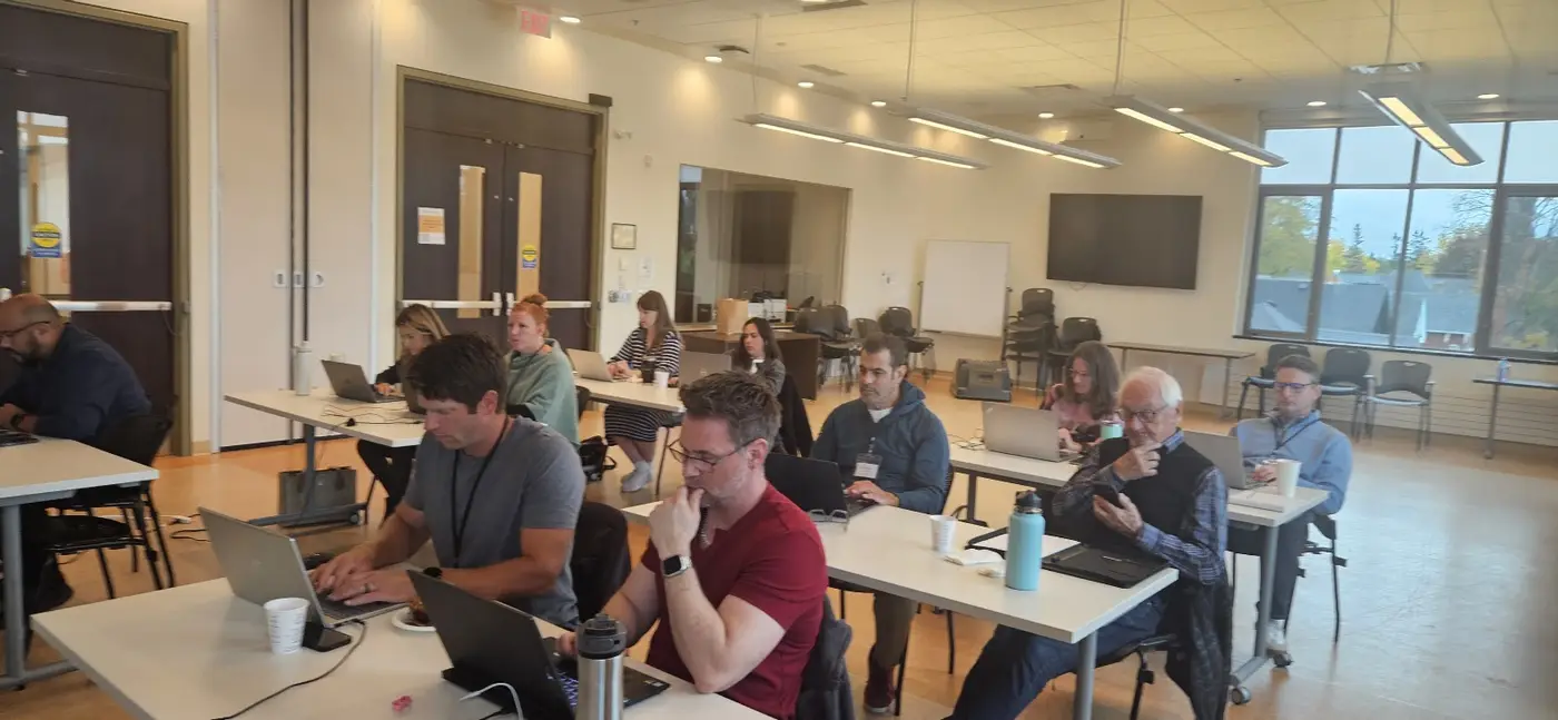 Participants at their laptops during a guided build
